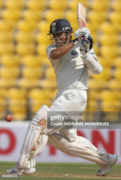 Indian cricketer Sachin Tendulkar plays a shot on the first day of the fourth and final Test match of the Gavaskar-Border Trophy 2008 series between...