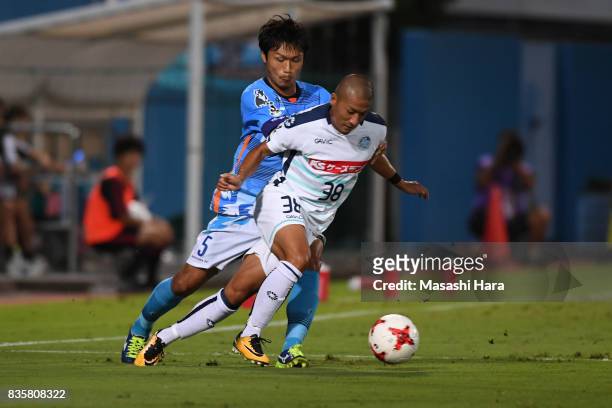 Daizen Maeda of Mito Hollyhock and Shogo Nishikawa compete for the ball during the J.League J2 match between Yokohama FC and Mito Hollyhock at...