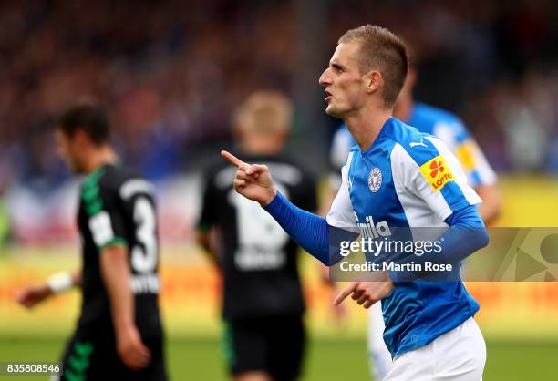 Dominick Drexler of Kiel celebrates after he scores the 3rd goal by penalty during the Second Bundesliga match between Holstein Kiel and SpVgg...