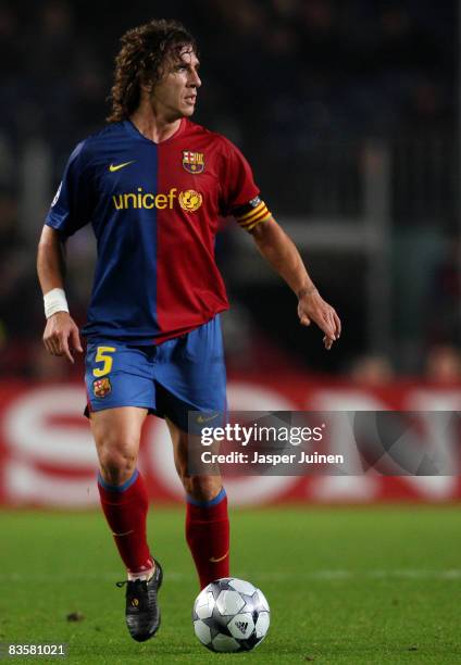 Carles Puyol of Barcelona runs with the ball during the UEFA Champions League Group C match between Barcelona and Basel at the Camp Nou stadium on...