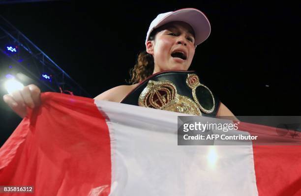 Peruvian boxer Linda Lecca celebrates after defending her World Boxing Association Super Flyweight crown for the fourth time by defeating Mexican...