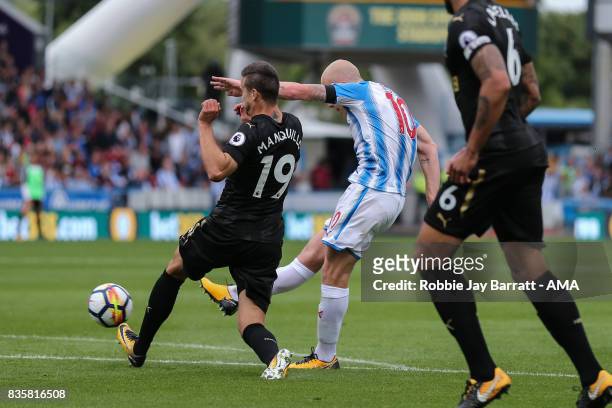 Aaron Mooy of Huddersfield Town scores a goal to make it 1-0 during the Premier League match between Huddersfield Town and Newcastle United at...