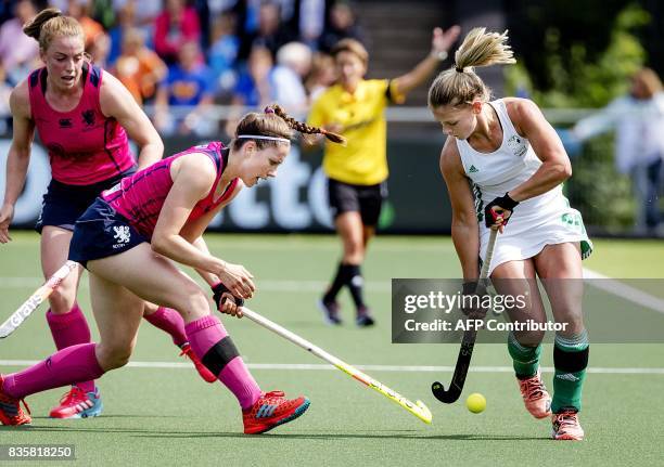 Chloe Watkins of Ireland fights for the ball with Amy Costello of Scotland during the women's Rabo EuroHockey Championships 2017 match between...