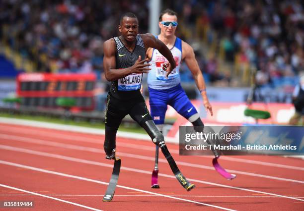 Ntando Mahlangu of South Africa wins the Mens T42 200m from Richard Whitehead of Great Britain during the Muller Grand Prix and IAAF Diamond League...