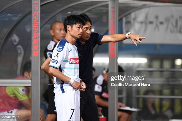 Keisuke Funatani and Takayuki Nishigaya,coach of Mito Hollyhock look on during the J.League J2 match between Yokohama FC and Mito Hollyhock at...