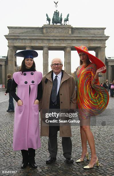 Designer Pierre Cardin poses with models wearing his creations in front of the Brandenburg Gate on November 6, 2008 in Berlin, Germany.