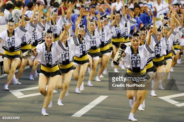 Dancers in colorful costumes perform the traditional Awa Odori folk dance on August 15, 2017 in Tokushima Prefecture, western Japan. Tokushima City's...
