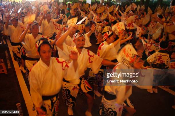 Dancers in colorful costumes perform the traditional Awa Odori folk dance on August 15, 2017 in Tokushima Prefecture, western Japan. Tokushima City's...