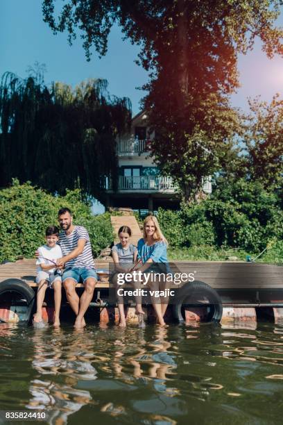 family fishing on jetty - 11 loch stock pictures, royalty-free photos & images