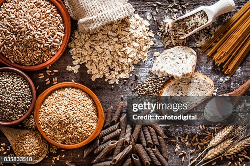 Wholegrain food still life shot on rustic wooden table Wholegrain food still life shot on rustic wooden table