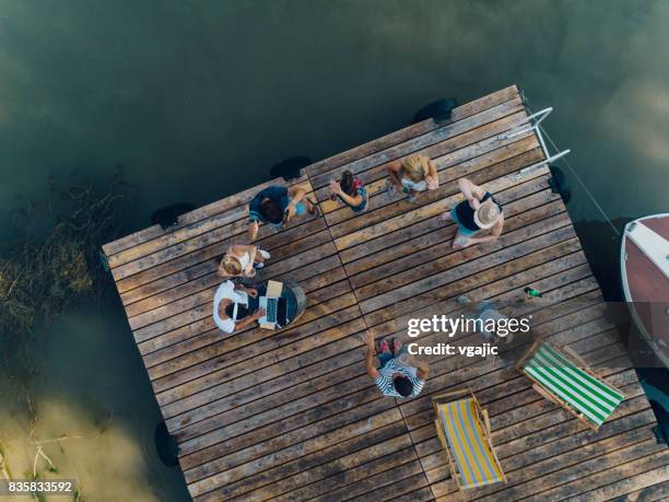 friends on summer party - party on the pier stock pictures, royalty-free photos & images