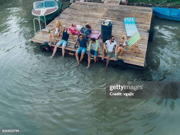 friends enjoying the summer on pier - party on the pier stock pictures, royalty-free photos & images