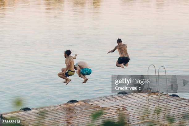 friends on summer party - party on the pier stock pictures, royalty-free photos & images