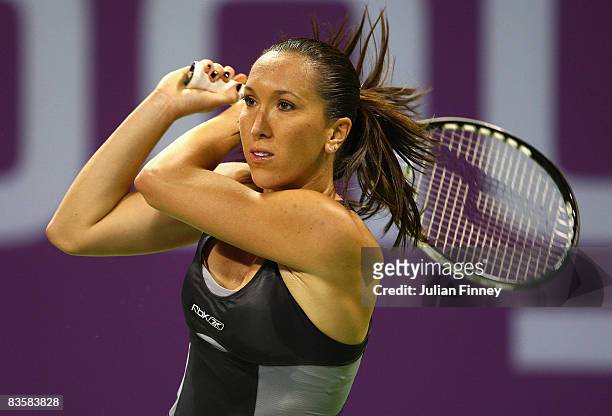 Jelena Jankovic of Serbia plays a backhand in her match against Svetlana Kuznetsova of Russia during the Sony Ericsson Championships at the Khalifa...