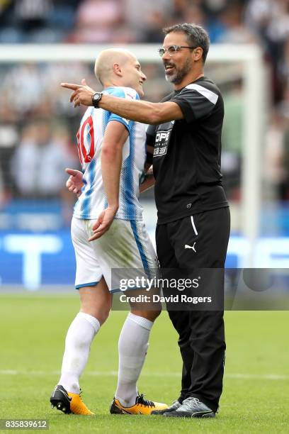 Aaron Mooy of Huddersfield Town and David Wagner, Manager of Huddersfield Town celebrate victory after the Premier League match between Huddersfield...