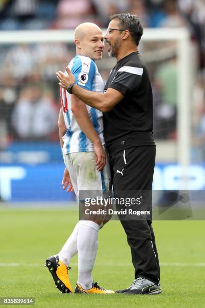 Aaron Mooy of Huddersfield Town and David Wagner, Manager of Huddersfield Town celebrate victory after the Premier League match between Huddersfield...