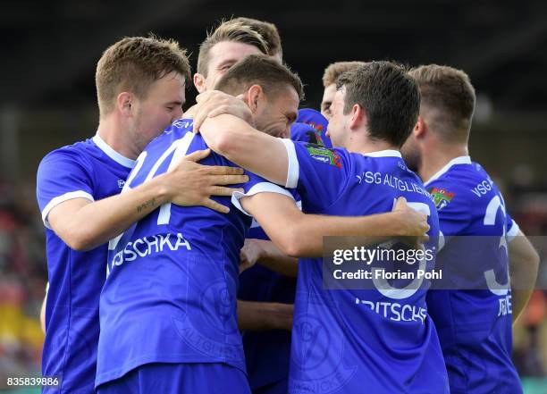 Kevin Stephan, Torsten Mattuschka, Fabian Fritsche and Stephan Brehmer of VSG Altglienicke celebrate after scoring the 1:1 during the game between...