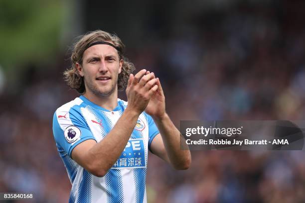 Michael Hefele of Huddersfield Town applauds the fans at full time during the Premier League match between Huddersfield Town and Newcastle United at...