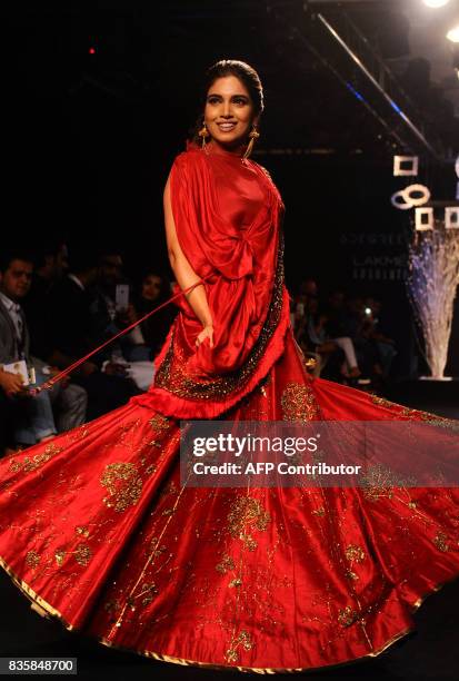 Indian Bollywood actress Bhumi Pednekar showcases a creation by designer Ruceru at Lakmé Fashion Week Winter /Festive 2017 in Mumbai on August 2017....