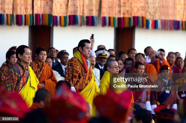 His Majesty Jigme Khesar Namgyel Wangchuck stands along side the former King Jigme Singye Wangchuck, and religious head Je Khenpo as the coronation...