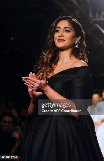 Indian Bollywood actress Ileana D'Cru showcases a creation by designer De Belle at the Lakme Fashion Week Winter/Festive 2017 in Mumbai on August 20,...