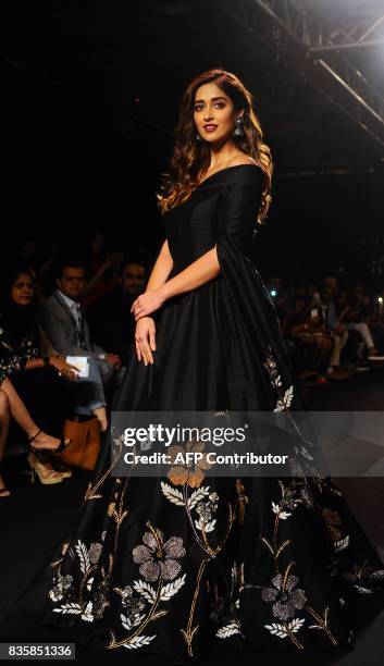 Indian Bollywood actress Ileana D'Cru showcases a creation by designer De Belle at the Lakme Fashion Week Winter/Festive 2017 in Mumbai on August 20,...