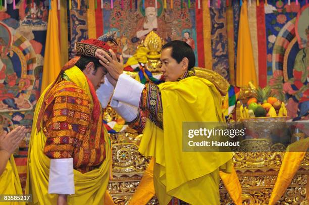 In this handout image supplied by Bhutan Government Department Of Information Technology , His Majesty Jigme Singye Wangchuck, the Fourth King crowns...