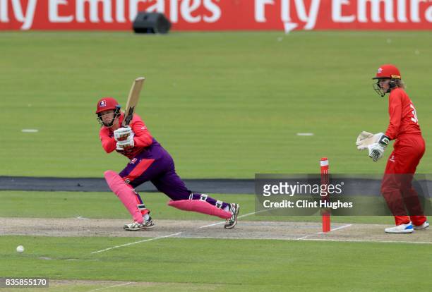 Sophie Taylor of Lancashire Thunder looks on as Abi Freeborn of Loughborough Lightning hits out during the Kia Super League match between Lancashire...
