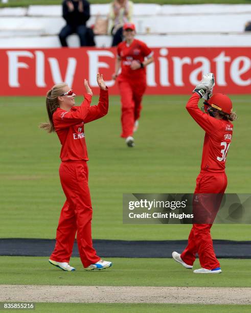 Sophie Ecclestone of Lancashire Thunder celebrates with team-mate Sarah Taylor after she takes the wicket of Sonia Odedra of Loughborough Lighning...