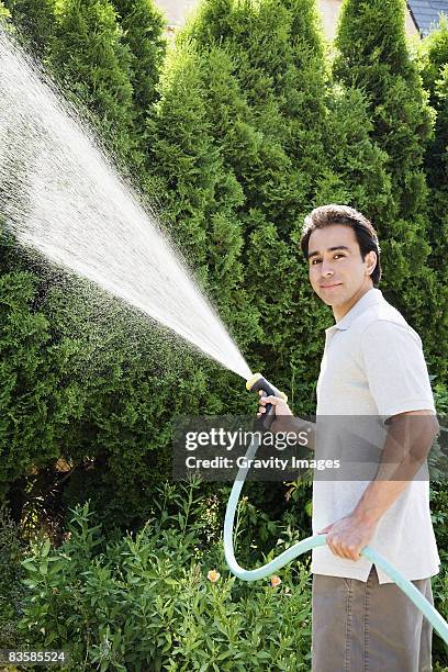 small family - man spraying stock pictures, royalty-free photos & images