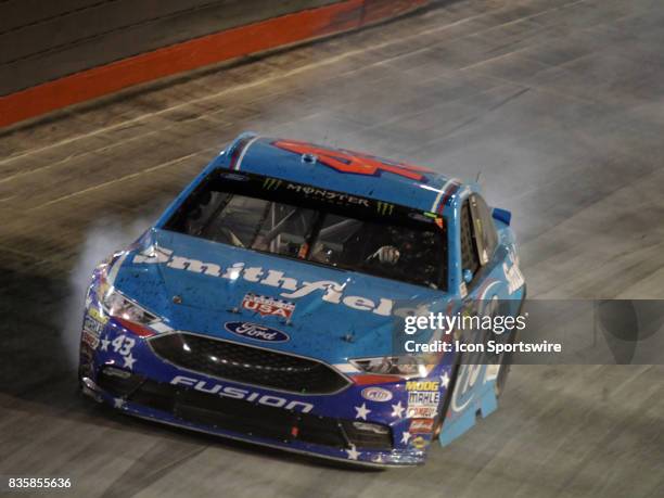 Smoke pours from Aric Almirola Richard Petty Motorsports Smithfield Foods Ford Fusion during the NASCAR Monster Energy Cup Series Bass Pro Shops NRA...