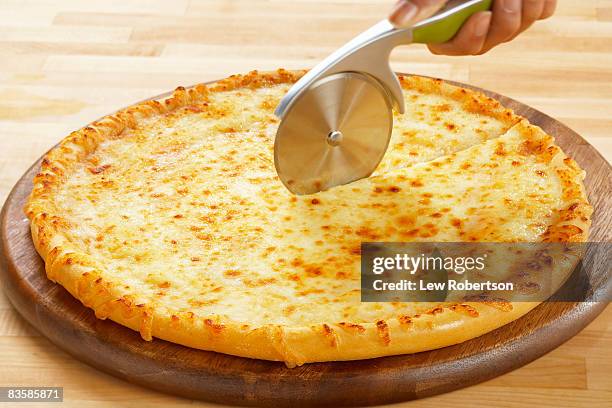 cheese pizza with cutter - margharita pizza stock pictures, royalty-free photos & images