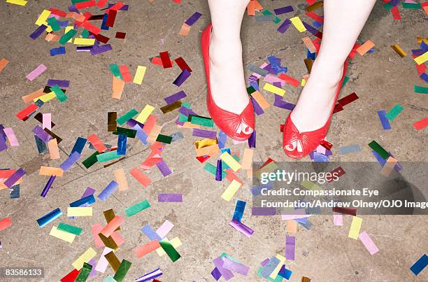 Woman's feet amongst confetti