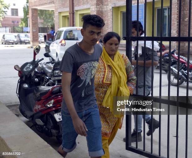 Aditya, son of Rishi Pal with other family member, after Rishi Pal was dead and left three people unconscious during sewer cleaning at Lok Nayak Jai...