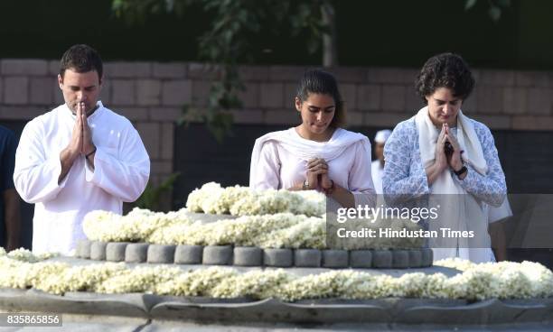 Congress Vice President Rahul Gandhi with his niece Miraya Vadra, and sister Priyanka Gandhi Vadra paying floral tributes to former Prime Minister...