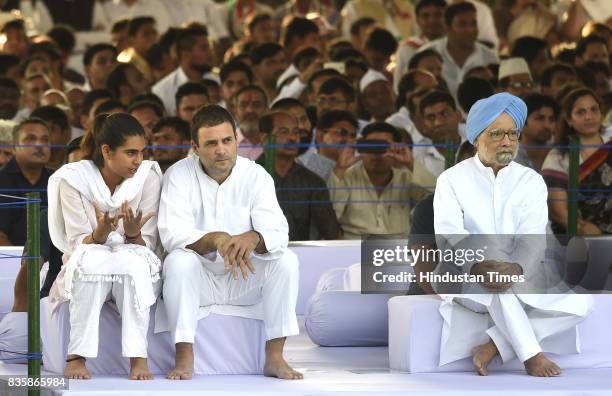 Congress Vice President Rahul Gandhi talking to his niece Miraya Vadra and former Prime Minister Manmohan Singh, after paying homage to former Prime...
