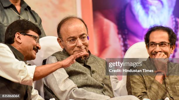 Shiv Sena MP Sanjay Raut, Union Minister Arun Jaitley and Shiv Sena Chief Uddhav Thackeray during the release of a compilation of a hundred...