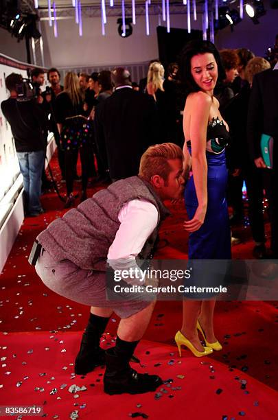 Katy Perry is kissed by Perez Hilton on the red carpet on arriving for the 2008 MTV Europe Music Awards held at at the Echo Arena on November 6, 2008...