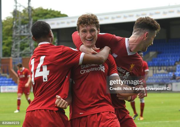 Matty Virtue of Liverpool celebrates his first goal with team mates Rhian Brewster and Corey Whelan during the Liverpool v Sunderland U23 Premier...