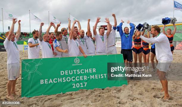 The players of Rostock celebrate with the trophy after winning the final match between Rostocker Robben and Ibbenbuerener BSC on day 2 of the 2017...