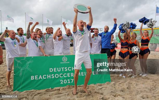 The players of Rostock celebrate with the trophy after winning the final match between Rostocker Robben and Ibbenbuerener BSC on day 2 of the 2017...