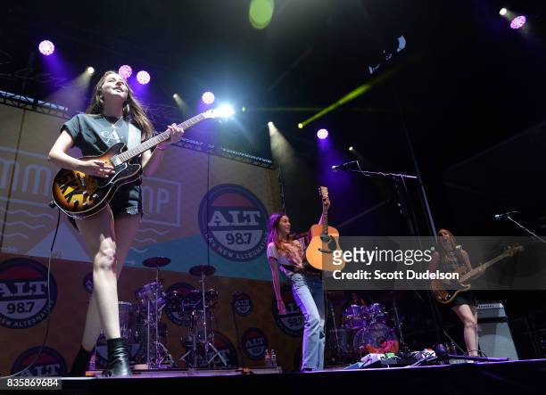 Singers Alana Haim , Danielle Haim and Este Haim of the band HAIM perform onstage during the Alt 98.7 Summer Camp concert at Queen Mary Events Park...