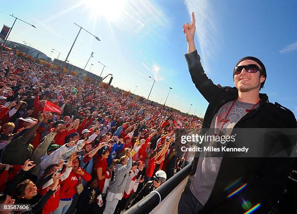 Philadelphia Phillies Chase Utley gestures number one to the crowd outside of Citizens Bank Park in Philadelphia during a parade to celebrate winning...