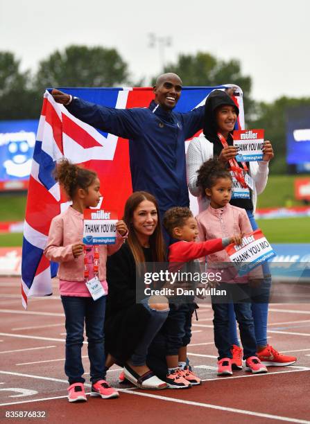 Mo Farah of Great Britain poses with his family after he won the Men's 3000m, his last UK track race during the Muller Grand Prix Birmingham as part...