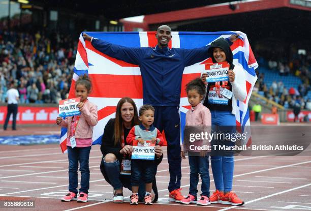 Mo Farah poses with his family after winning the men's 3000m during the Muller Grand Prix and IAAF Diamond League event at Alexander Stadium on...