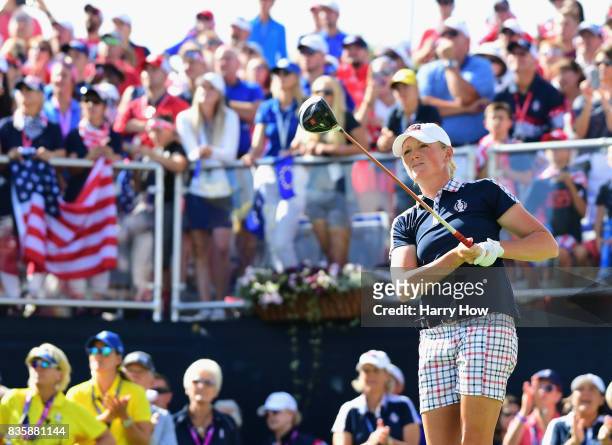Stacy Lewis of Team USA hits a tee shot on the first hole in her match against Catriona Matthew of Team Europe during the final day singles matches...