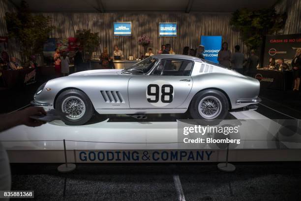 The 1966 Ferrari 275 GTB/C sits on display at the Gooding and Company auction during the 2017 Pebble Beach Concours d'Elegance in Pebble Beach,...