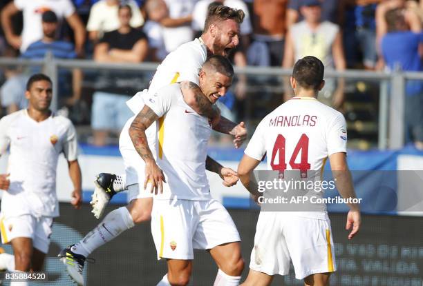 Roma's Serbian defender Aleksandar Kolarov celebrates with AS Roma's midfielder Daniele De Rossi after scoring a goal during the Italian Serie A...