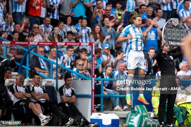 Michael Hefele of Huddersfield Town prepares to come on as a substitute during the Premier League match between Huddersfield Town and Newcastle...