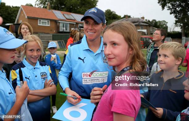 Lauren Winfield of Yorkshire Diamonds and young cricket fans after the Kia Super League between Yorkshire Diamonds v Western Storm at York on August...
